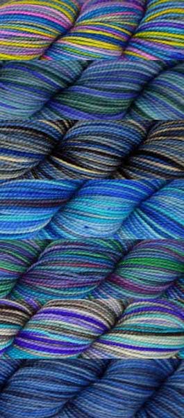 7 skeins of various hand-dyed colorways in a blue base